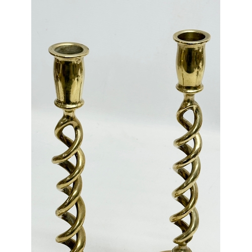 428 - A pair of large Mid 20th Century brass barely twist candlesticks. 29cm