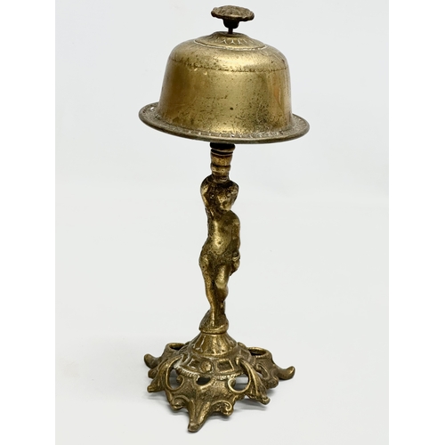 429 - An Early 20th Century brass counter bell. 25cm