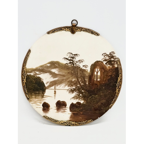 185 - A pair of Early 20th Century oil on porcelain wall plaques. With pierced brass rims. 20.5x22cm.