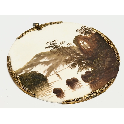 185 - A pair of Early 20th Century oil on porcelain wall plaques. With pierced brass rims. 20.5x22cm.