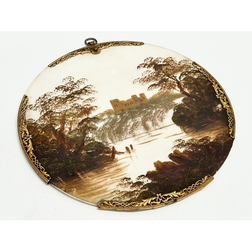 185 - A pair of Early 20th Century oil on porcelain wall plaques. With pierced brass rims. 20.5x22cm.