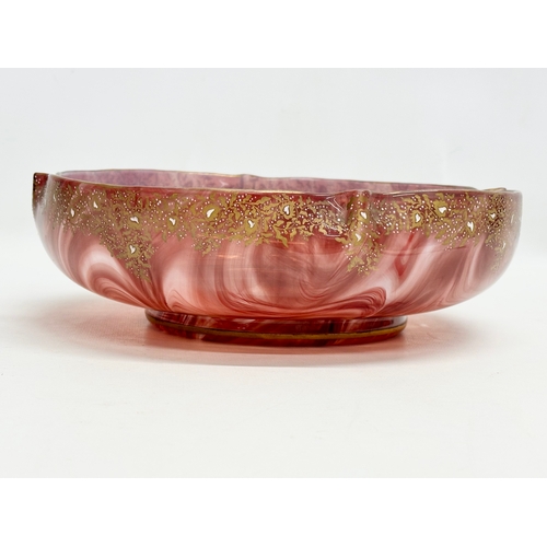 21 - Loetz Carneol. A large Late 19th Century Bohemian glass bowl, with hand painted embossed gilding and... 