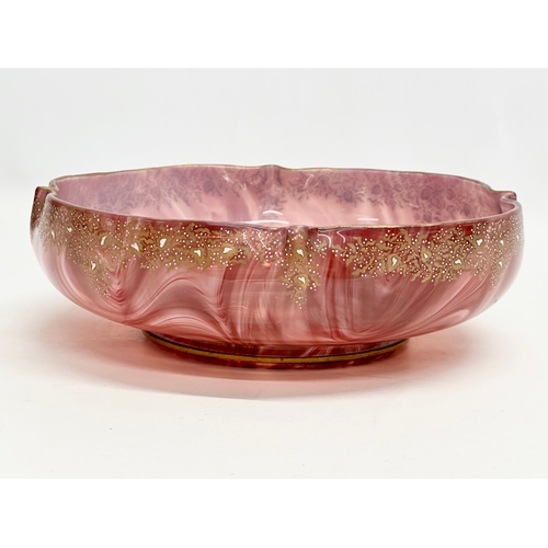 21 - Loetz Carneol. A large Late 19th Century Bohemian glass bowl, with hand painted embossed gilding and... 