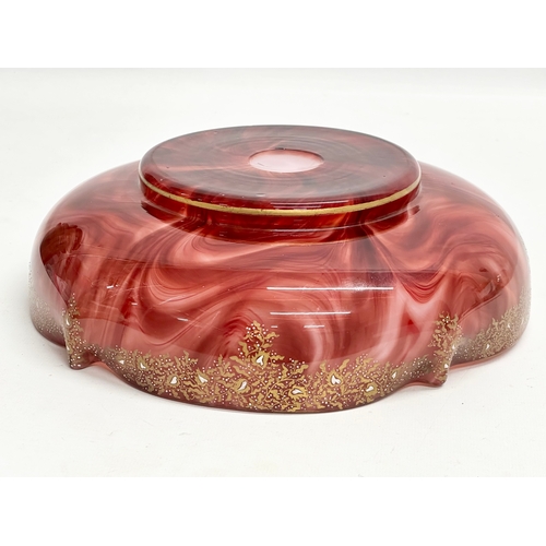 21 - Loetz Carneol. A large Late 19th Century Bohemian glass bowl, with hand painted embossed gilding and... 