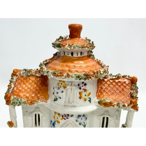 77 - Three 19th Century Staffordshire Pottery houses. 18x21cm. 11x7x13cm. 10x13cm.