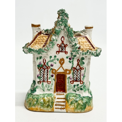 77 - Three 19th Century Staffordshire Pottery houses. 18x21cm. 11x7x13cm. 10x13cm.