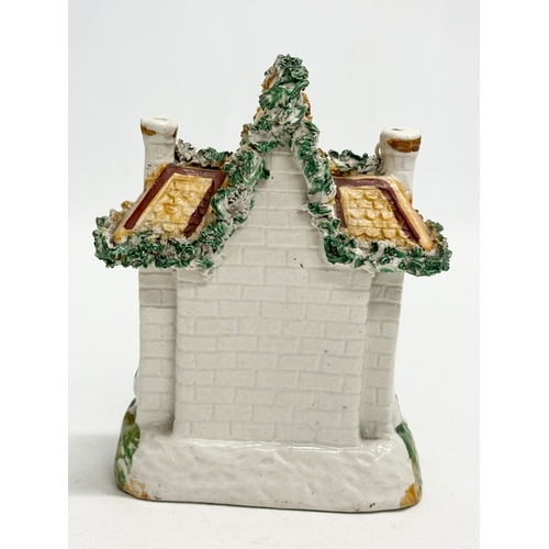 77 - Three 19th Century Staffordshire Pottery houses. 18x21cm. 11x7x13cm. 10x13cm.