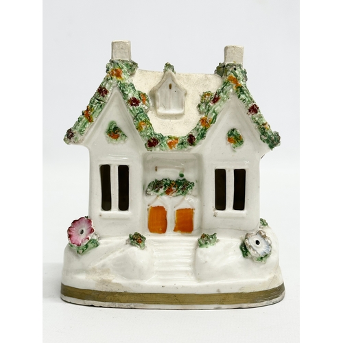 77 - Three 19th Century Staffordshire Pottery houses. 18x21cm. 11x7x13cm. 10x13cm.