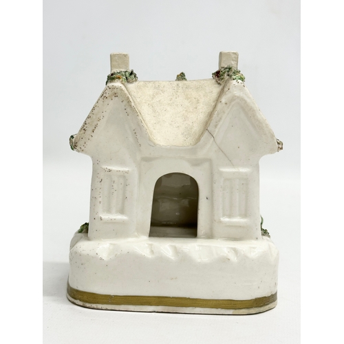 77 - Three 19th Century Staffordshire Pottery houses. 18x21cm. 11x7x13cm. 10x13cm.