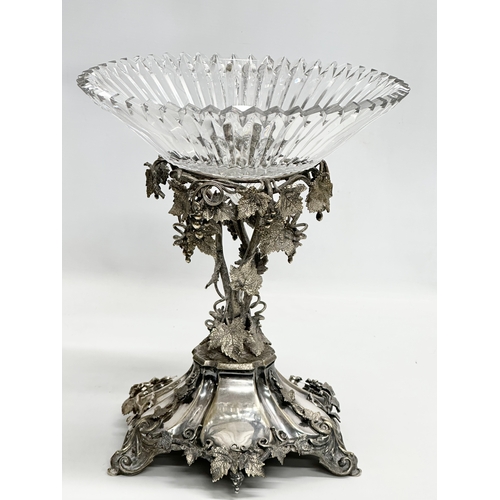 23 - A large Mid 19th Century plated comport taza with large slice cut glass bowl. Decorated with moulded... 