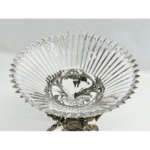 23 - A large Mid 19th Century plated comport taza with large slice cut glass bowl. Decorated with moulded... 