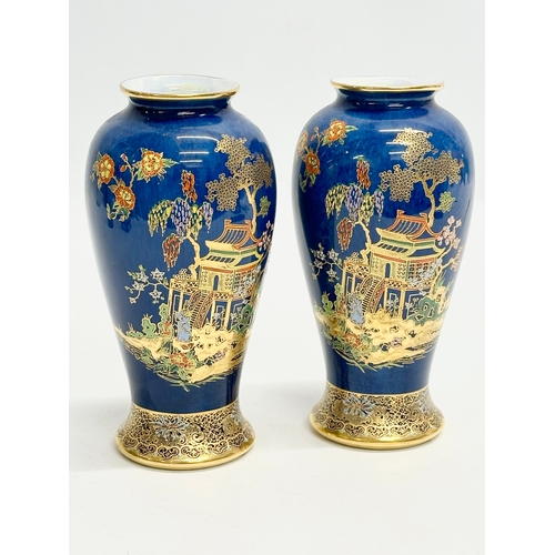 80 - A pair of Early 20th Century Carlton Ware ‘Kang Hsi’ mikado lustre vases. 15.5cm