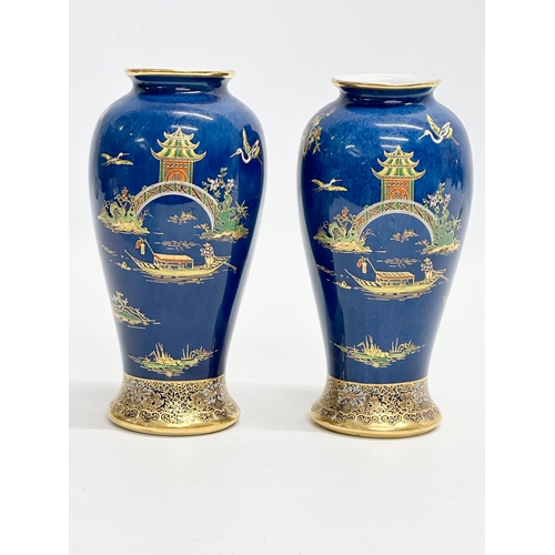 80 - A pair of Early 20th Century Carlton Ware ‘Kang Hsi’ mikado lustre vases. 15.5cm