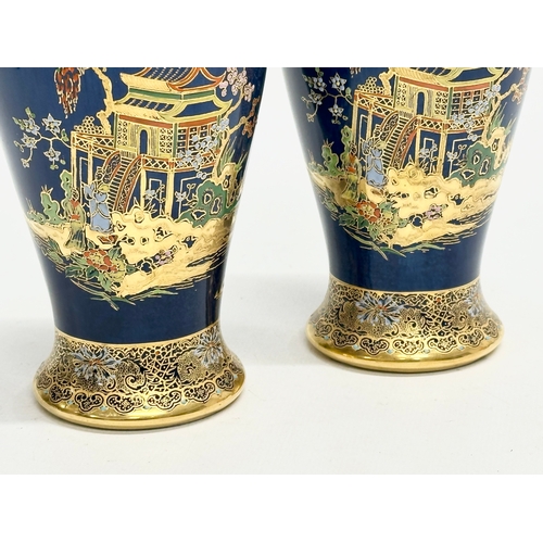 80 - A pair of Early 20th Century Carlton Ware ‘Kang Hsi’ mikado lustre vases. 15.5cm