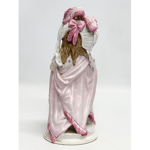 86 - A pair of Late 19th Century German hand painted porcelain ‘Mama Papa’ figurines. 27cm