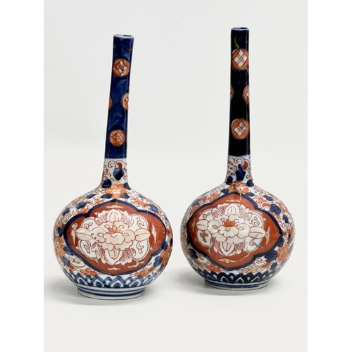 92 - A pair of Late 19th Century Japanese Imari pottery bottle vases. Meiji Period (1868-1912) circa 1880... 