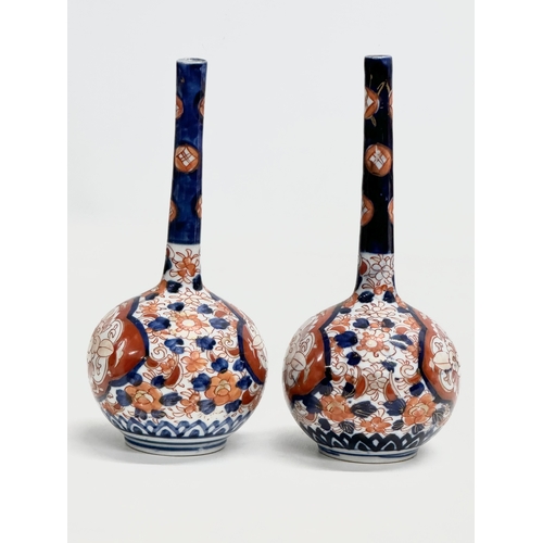 92 - A pair of Late 19th Century Japanese Imari pottery bottle vases. Meiji Period (1868-1912) circa 1880... 