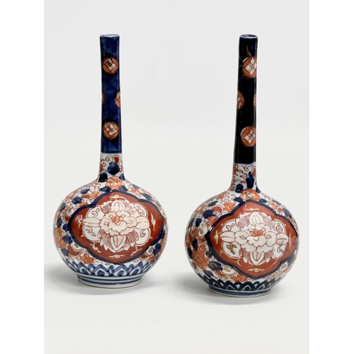 92 - A pair of Late 19th Century Japanese Imari pottery bottle vases. Meiji Period (1868-1912) circa 1880... 