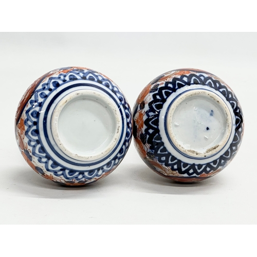 92 - A pair of Late 19th Century Japanese Imari pottery bottle vases. Meiji Period (1868-1912) circa 1880... 