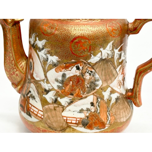 93 - A 19th Century Japanese hand painted teapot by Kutani. Painted figures and birds in flight, with a m... 