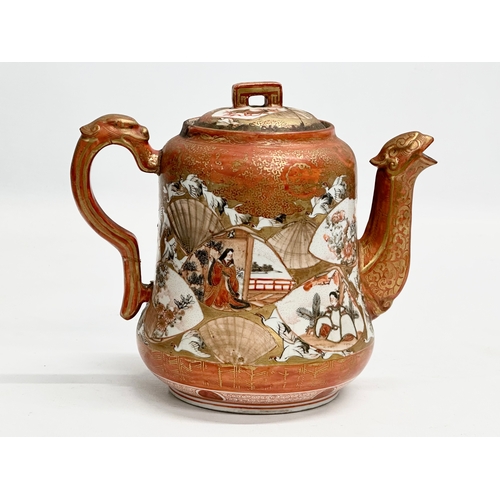 93 - A 19th Century Japanese hand painted teapot by Kutani. Painted figures and birds in flight, with a m... 