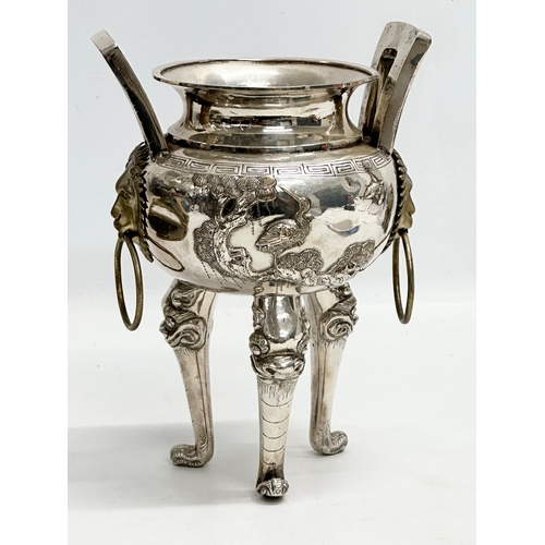 94 - A 20th Century Chinese silver plated urn. Raised on 3 Foo Dog feet, with brass lion mask ring handle... 