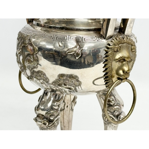 94 - A 20th Century Chinese silver plated urn. Raised on 3 Foo Dog feet, with brass lion mask ring handle... 