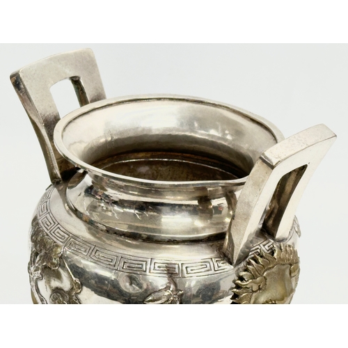 94 - A 20th Century Chinese silver plated urn. Raised on 3 Foo Dog feet, with brass lion mask ring handle... 