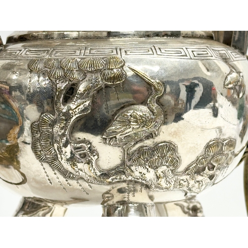 94 - A 20th Century Chinese silver plated urn. Raised on 3 Foo Dog feet, with brass lion mask ring handle... 