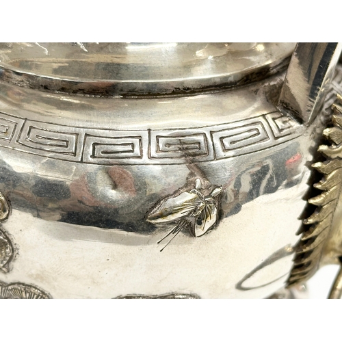 94 - A 20th Century Chinese silver plated urn. Raised on 3 Foo Dog feet, with brass lion mask ring handle... 