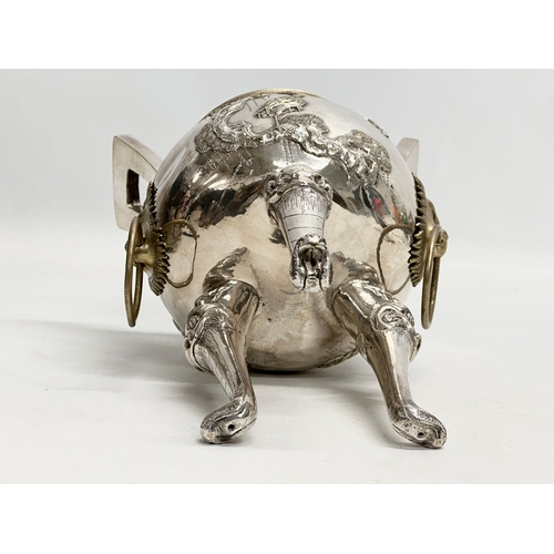 94 - A 20th Century Chinese silver plated urn. Raised on 3 Foo Dog feet, with brass lion mask ring handle... 