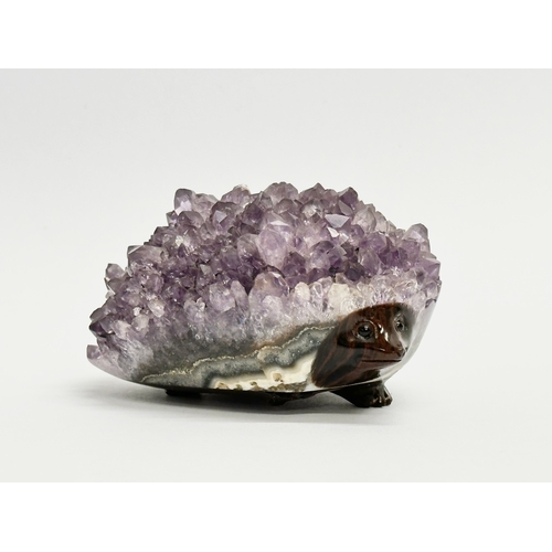 436 - An amethyst and glass hedgehog. 8.5x6cm