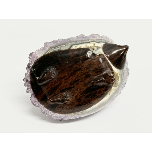 436 - An amethyst and glass hedgehog. 8.5x6cm