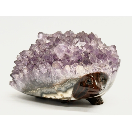 436 - An amethyst and glass hedgehog. 8.5x6cm