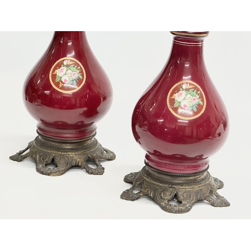 29 - A pair of large Late 19th Century hand painted porcelain table lamps with gilded brass base. 43cm