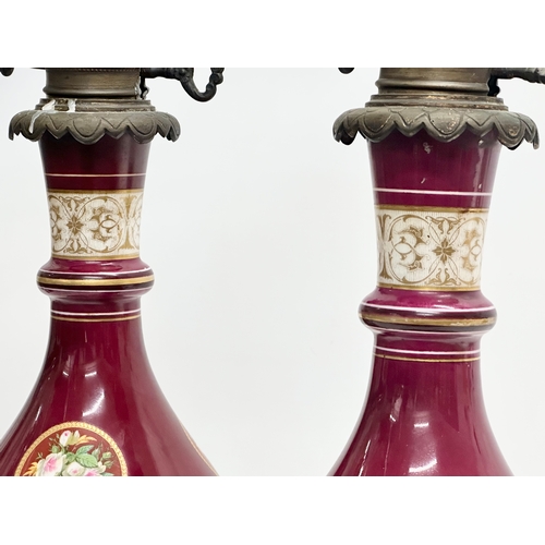 29 - A pair of large Late 19th Century hand painted porcelain table lamps with gilded brass base. 43cm