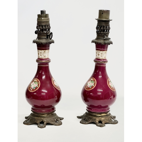 29 - A pair of large Late 19th Century hand painted porcelain table lamps with gilded brass base. 43cm