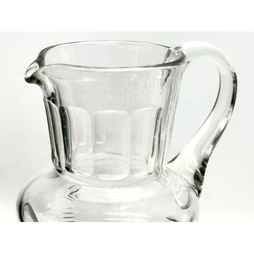 99 - A large Late 19th/Early 20th Century champagne jug. Circa 1900. 32cm