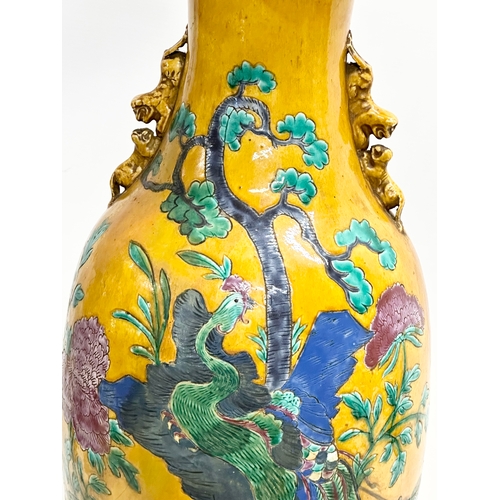 33 - A very large Early/Mid 20th Century Chinese glazed table lamp. Decorated with lotus leaves and peaco... 