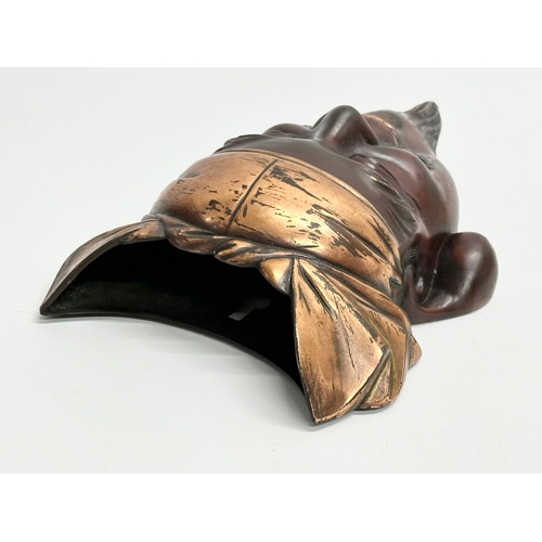 71 - A 19th Century Japanese bronze mask wall pocket. Meiji Period (1868-1912) 14.5x25cm