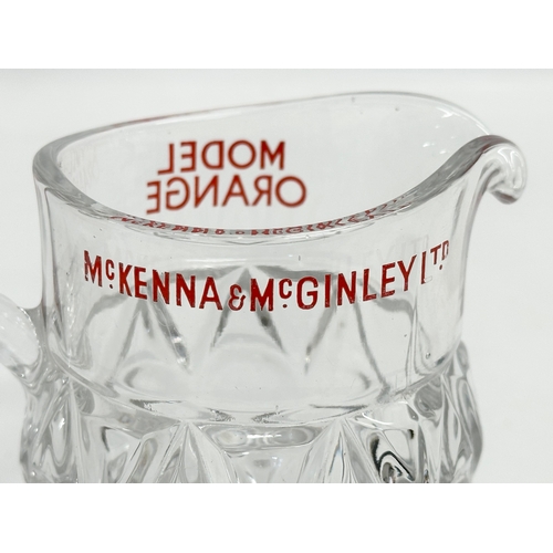 409 - A McKenna & McGinley LTD ‘Model Orange’ glass jug. 14x8x11cm.