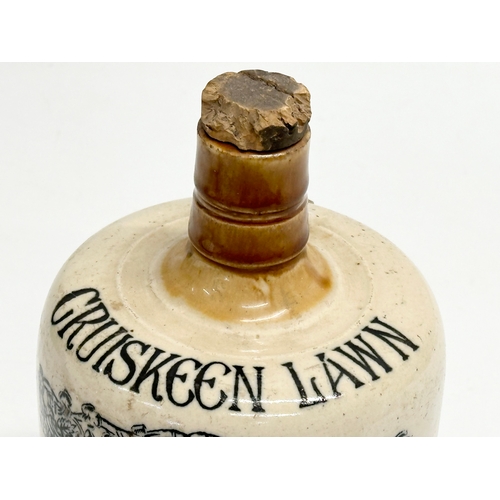 444 - A Mitchell’s Old Irish Whiskey ‘Cruiskeen Lawn’ whiskey jug. Midland Pottery Melling Liverpool. 20cm