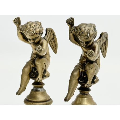 190 - A pair of Late 19th Century heavy brass cherubs. 14cm