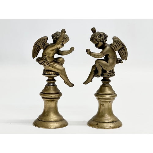 190 - A pair of Late 19th Century heavy brass cherubs. 14cm