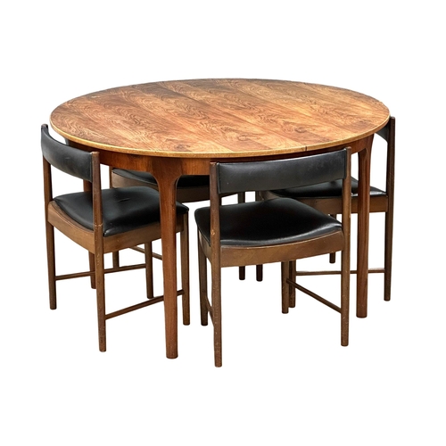 810 - A McIntosh Mid Century rosewood dining table and 4 chairs. Designed by Tom Robertson. (2)