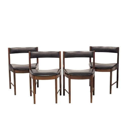 810 - A McIntosh Mid Century rosewood dining table and 4 chairs. Designed by Tom Robertson. (2)