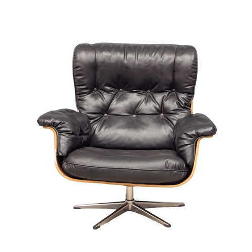 816 - A Charles and Ray Eames style swivel armchair (1)