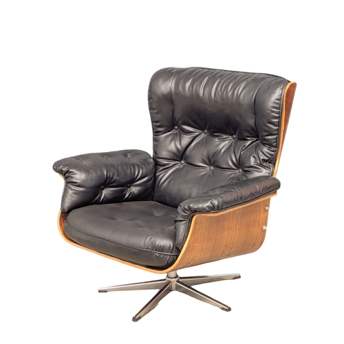 816 - A Charles and Ray Eames style swivel armchair (1)