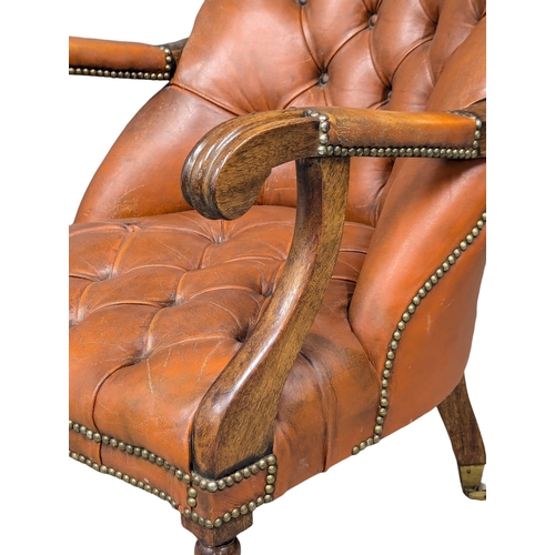 818 - A William IV style mahogany deep button gents armchair (1)