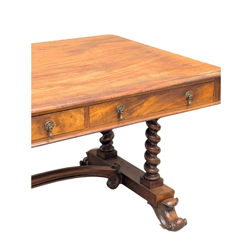 819 - A large Early Victorian mahogany library table with Barley Twist supports raised on Cabriole legs. 1... 